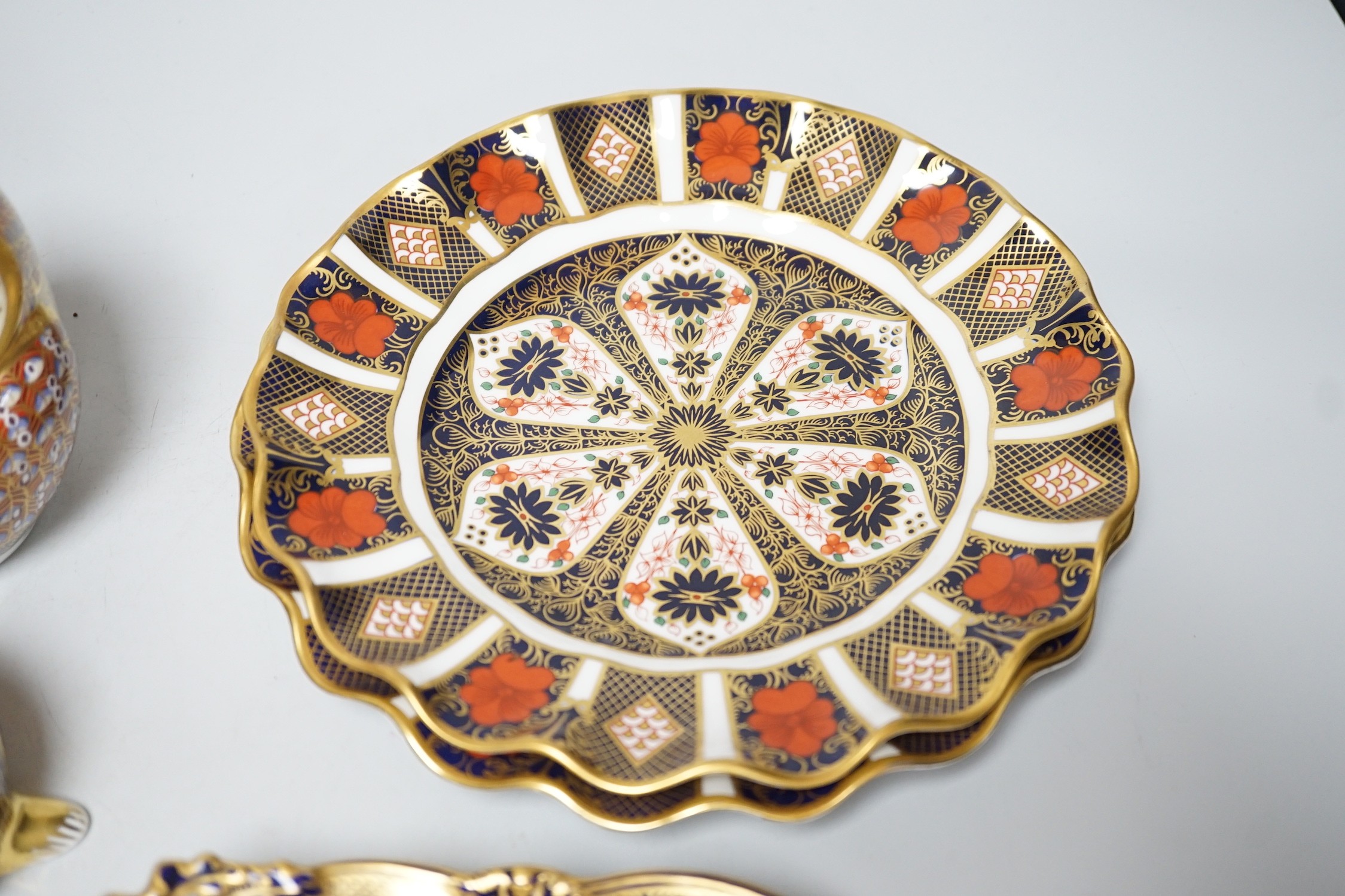 Four various Royal Crown Derby 1128-pattern dishes, plates 21cm, and three Royal Crown Derby paperweights